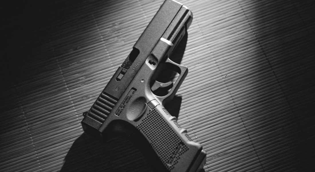 a glock on a silver surface
